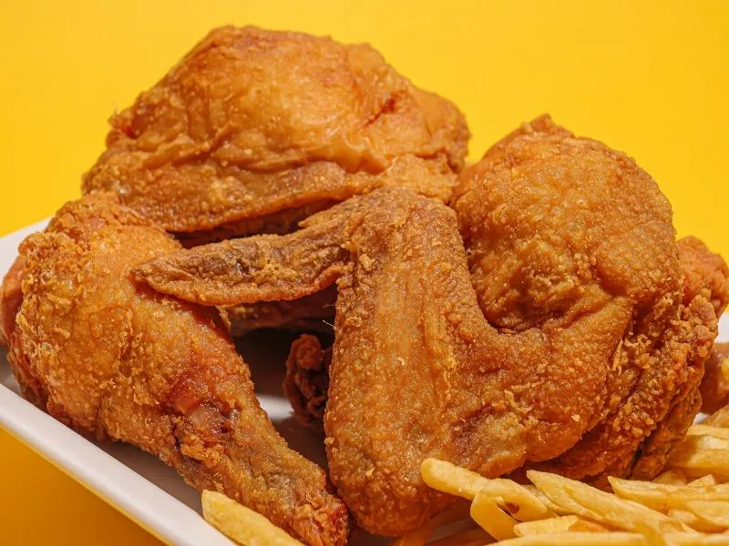 Golden crispy fried chicken pieces paired with french fries at China Moon, a Chinese Restaurant in Twinsburg